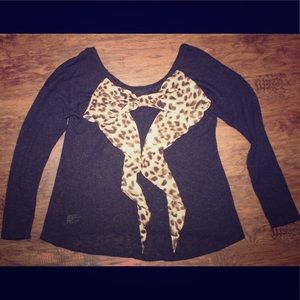 Black knit sweater with design on the back